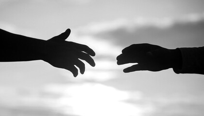 Outstretched hands, salvation, help silhouette, concept of help. Giving a helping hand. Rescue,...