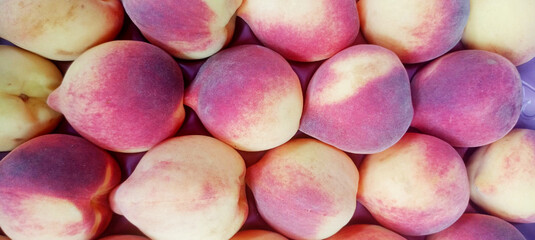 Peaches (Prunus persica), natural background, Full frame. Peach is rich in fiber, good for bowel function. Contains minerals such as phosphorus, magnesium, manganese, copper, iodine and iron. 