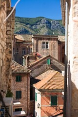 Old European City, the historic stone buildings and terracotta roofs of Kotor, with the ancient fortifications ascending the mountainside.