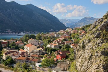 Fototapeta na wymiar The historic town of Kotor, Montenegro, unfolds along the shores of the Adriatic, embraced by dramatic mountains and the tranquil bay.