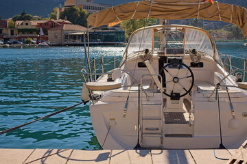 A sleek Elan sailboat rests in the tranquil marina of Kotor, inviting a maritime adventure in the...