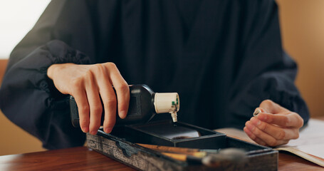 Black ink, calligraphy or hands of Japanese artist in studio for art and script, letter with...