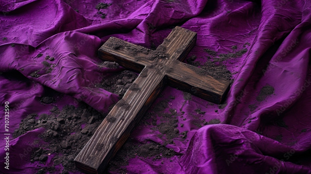 Wall mural Ash Wednesday still life of a wooden cross lying on a purple cloth, ashes scattered around, reflective and spiritual theme, Wooden Cross and Ashes on Purple Cloth for Ash Wednesday - Wall murals