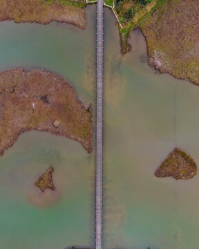 Aerial view of the walkway crossing the Lake Vistonida at Saint Nicholas monastery, East Macedonia and Thrace, Greece.
