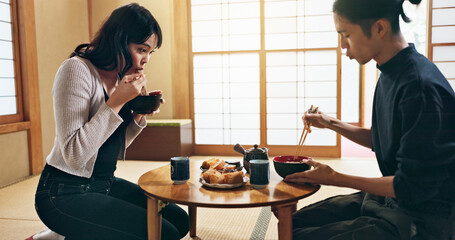 Asian people, bow for hello and eating food, couple on date with respect, culture and love together in Japan. Hungry for Japanese cuisine, trust with commitment and greeting for religion and care © N F/peopleimages.com