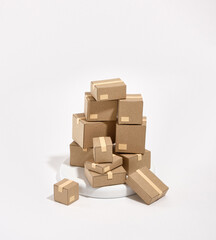Lots of cardboard boxes on a white round stand. Composition of move.