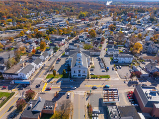 Fototapeta na wymiar Milford Town Hall aerial view in fall at 52 Main Street in historic town center of Milford, Massachusetts MA, USA. 
