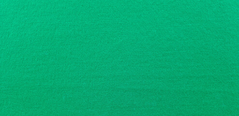 Texture of felt fabric in dark green color for background