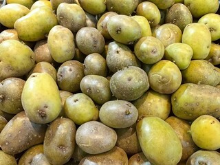 Green potatoes in the supermarket