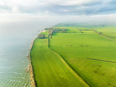 Aerial view of IJsselmeer coastline with dike in front of Oudemirdumer Klif, Oudemirdum, Gaasterland, Friesland, Netherlands.