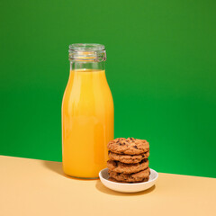 Fresh orange juice and cookies with chocolate chunks. Delicious breakfast.