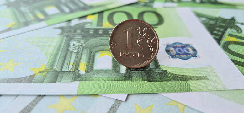 One hundred Euro European Union banknotes and one Russian ruble