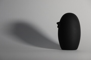 A small decorative black wooden bird with shading. Perfect as a wallpaper.