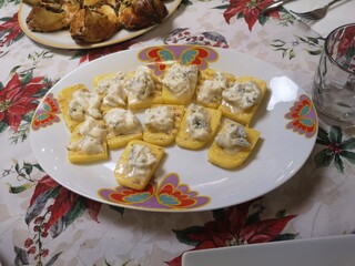 Plate with polenta and gorgonzola green cheese-