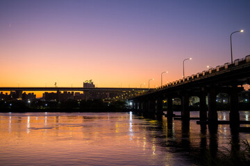 Fototapeta na wymiar Bridge cross the river in Taipei city at sunset