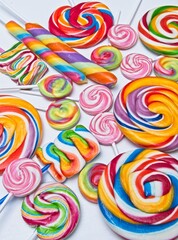 Fototapeta na wymiar Multicolored candy lollies close ups on white background