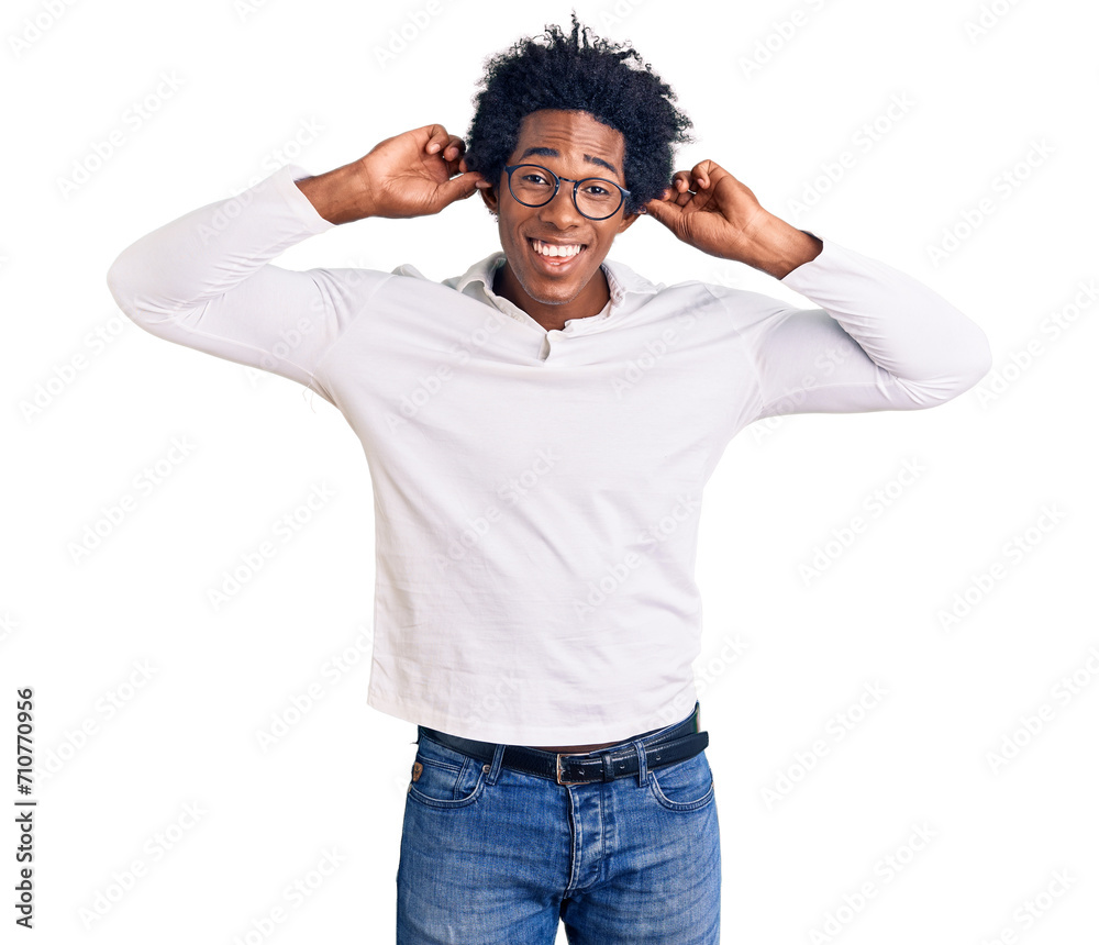 Poster handsome african american man with afro hair wearing casual clothes and glasses smiling pulling ears