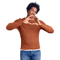 Handsome african american man with afro hair wearing casual clothes smiling in love doing heart symbol shape with hands. romantic concept.