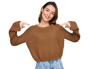 Young caucasian girl wearing casual clothes looking confident with smile on face, pointing oneself...