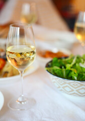 People fine dining seafood and white wine