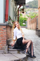 Fototapeta premium Outdoor fashion portrait of glamour sensual young stylish lady