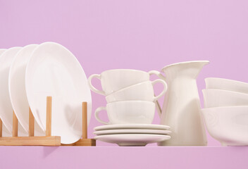 Beautiful table setting. Ceramic white crockery. Modern interior design.