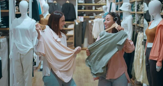 Friends enjoy women's shopping clothing store in mall selecting trendy outfits. Women's shopping epitomizes modern lifestyle happiness Women's shopping symbol prosperity beautiful choices.