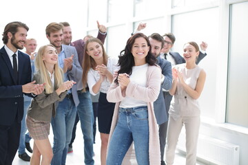 business team congratulating their leader. success concept