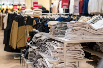 Clothing store, clothes arranged on shelves