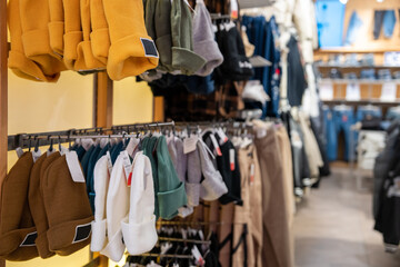 Clothing store, clothes arranged on shelves