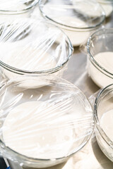 Glass mixing bowls with white royal icing