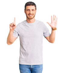 Handsome young man with bear wearing casual tshirt showing and pointing up with fingers number six while smiling confident and happy.