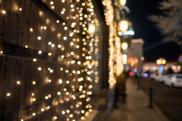 A street decorated with Christmas lights