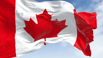 Close-up of Canada national flag waving in the wind on a clear day