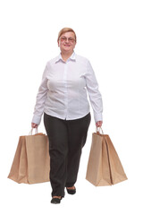 Full length portrait of a woman walking with shopping bags