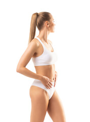 Obraz premium Perfect body of young and beautiful woman in swimsuit isolated on white. Weight loss, diet, sport and fitness concepts.