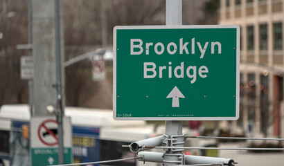 brooklyn bridge sign on the side of the road in downtown brooklyn, new york city (famous landmark...