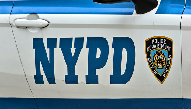 Police logo on the side of NYPD police car cruiser