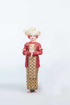 a female model wearing traditional Lampung clothing, traditional female Lampung dancers in front view, isolated on white