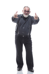 Fototapeta premium in full growth. smiling man with glasses giving a thumbs up