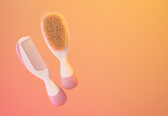 Body brush and hair comb. Baby care and treatments. Copy space for text.