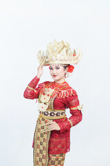 female model wearing Lampung siger crown or traditional Lampung clothing with gold accessories and...