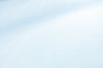 gradient background of a snowy hill with shadows on it