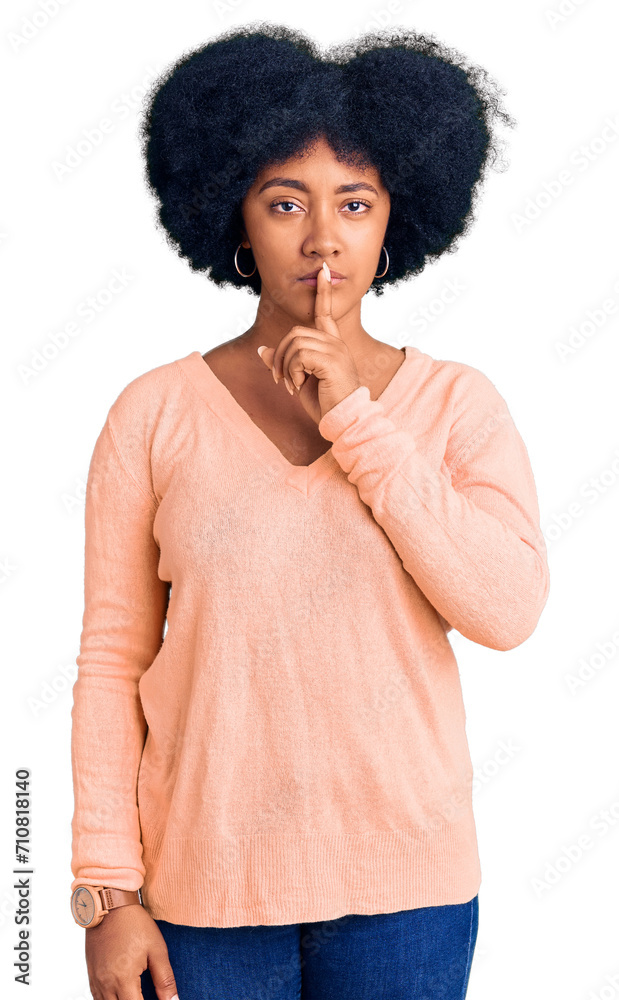 Sticker young african american girl wearing casual clothes asking to be quiet with finger on lips. silence a