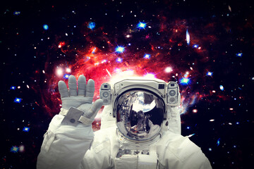 Astronaut surfing dark space with stars. The elements of this image furnished by NASA.