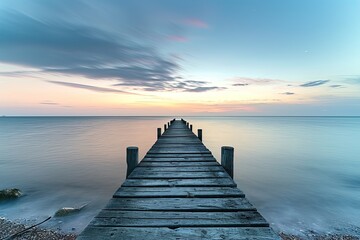 Wooden pier in the Baltic Sea at sunset. Long exposure.