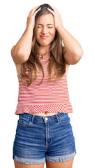 Beautiful caucasian young woman wearing casual clothes suffering from headache desperate and stressed because pain and migraine. hands on head.