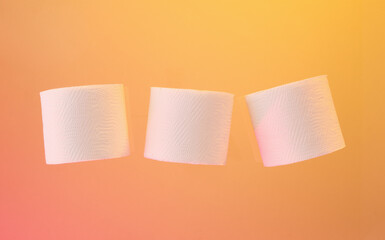 Three white soft rolls of toilet paper. Idea of housework.