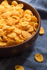 Corn flakes for breakfast in a bowl, close-up