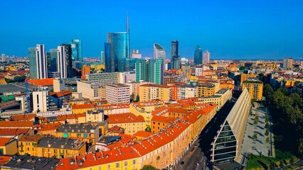 Aerial view of modern stylish cityscape of business skyscrapers. unicredit tower and UnipolSai, Microsoft Italia. Skyline. Drone. Sunny day and blue sky. Fashion city. Europe Italy Milan 01.2024